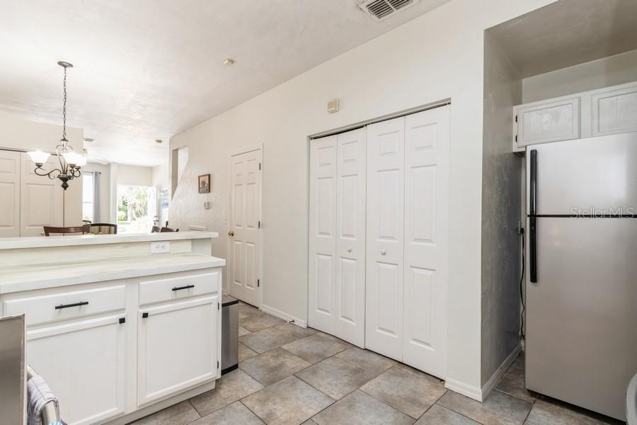 4415 Southwest 34th Street, Unit 204 Gainesville, FL 32608 - Photo 10 of 33 a kitchen with white cabinets and refrigerator