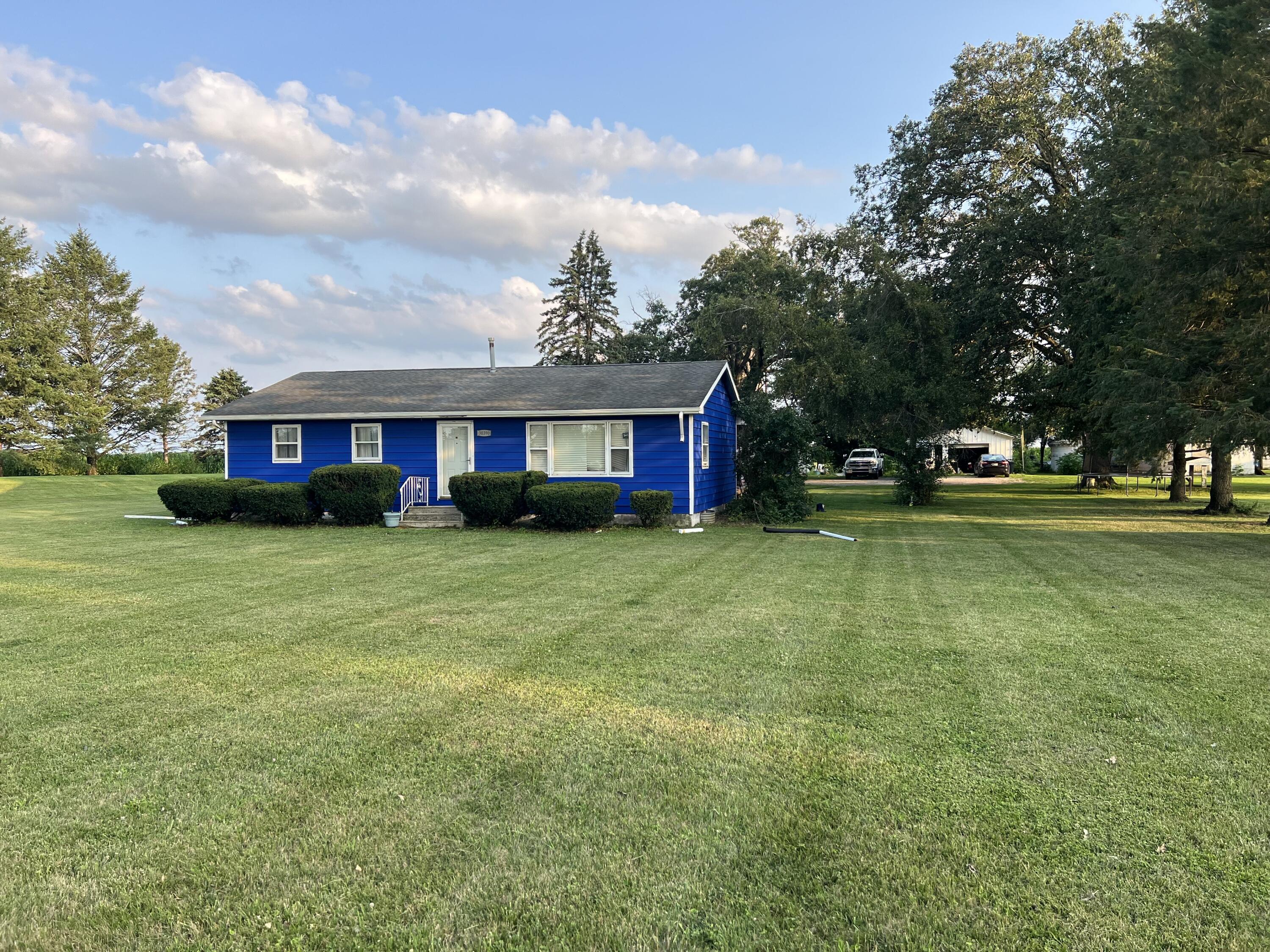 30390 Inwood Road North Liberty, IN 46554 - Photo 1 of 4 a view of house with outdoor space and swimming pool