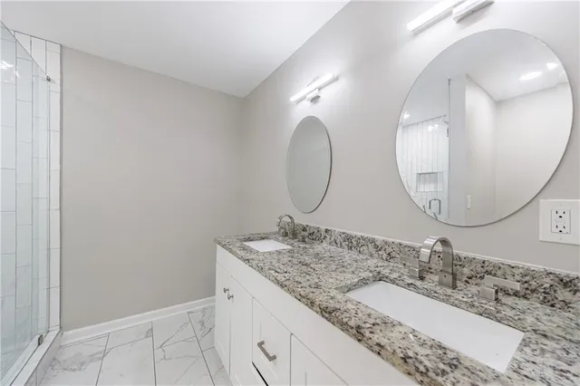 an empty room with wooden floor ceiling fan and window