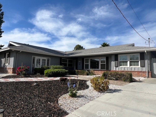 31156 Danelaw Avenue Redlands, CA 92373 - Photo 4 of 8 a front view of a house with garden and porch