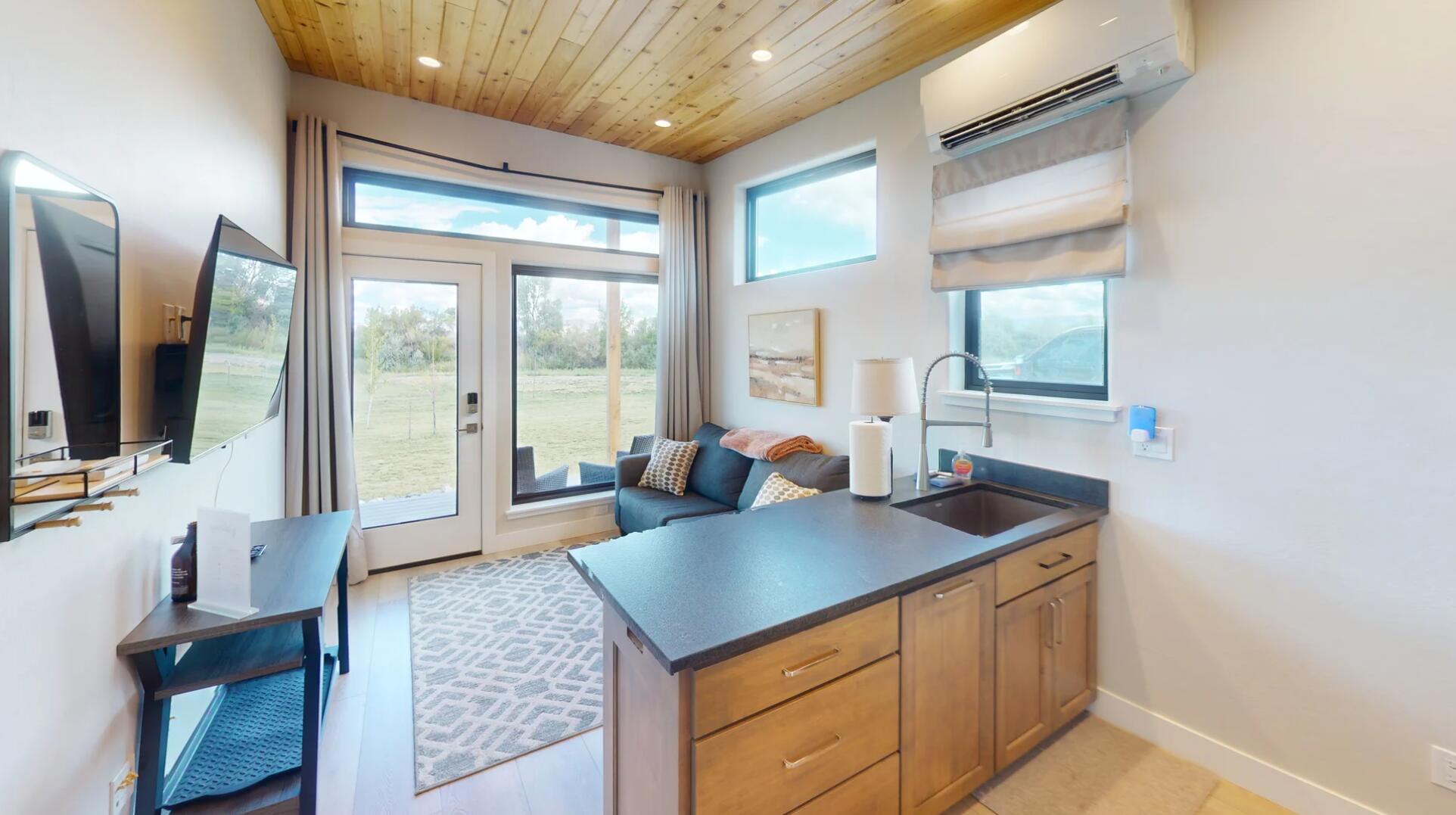 176 Alexander Overlook Telluride, CO 81435 - Photo 14 of 18 a kitchen with stainless steel appliances granite countertop a sink a stove and a refrigerator