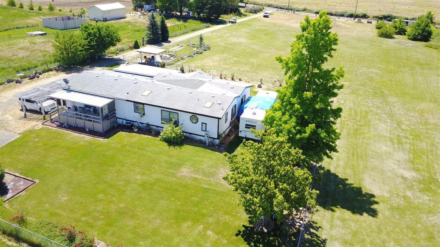 5390 Lower River Road Grants Pass, OR 97526 - Photo 10 of 35 a view of a big yard with large tree