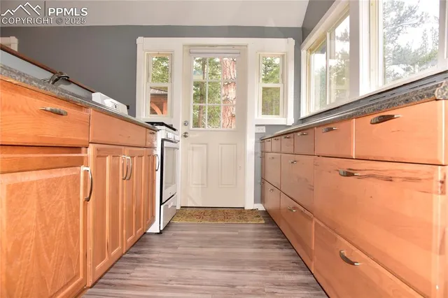 a view of a house with wooden floor and windows