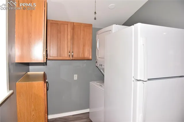 a white refrigerator freezer sitting in a kitchen