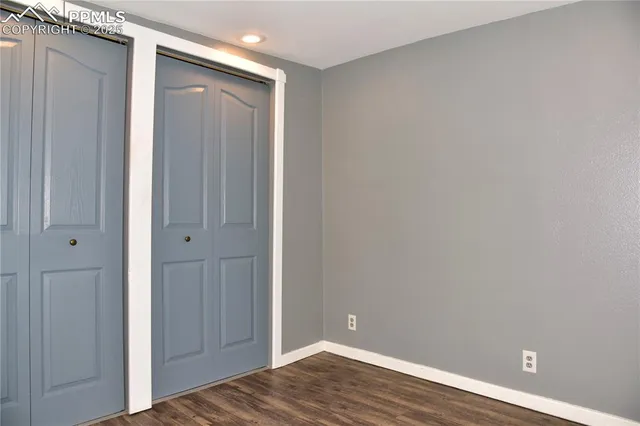 a view of room with wooden floor