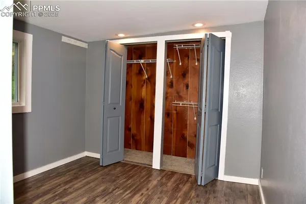 an entryway with wooden floor