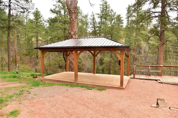 a view of a backyard with a small cabin