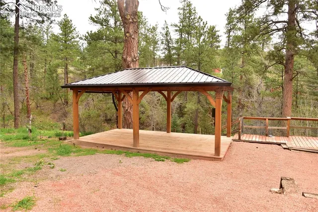 a view of a backyard with a small cabin