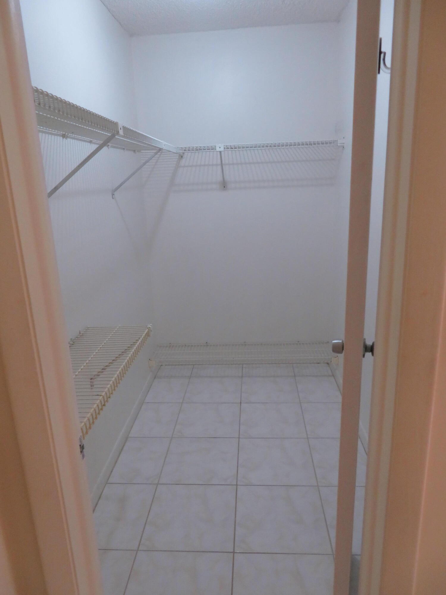 9233 Southwest 8th Street, Unit 409 Boca Raton, FL 33428 - Photo 36 of 40 54 9233-409 MBR-Walkin Closet