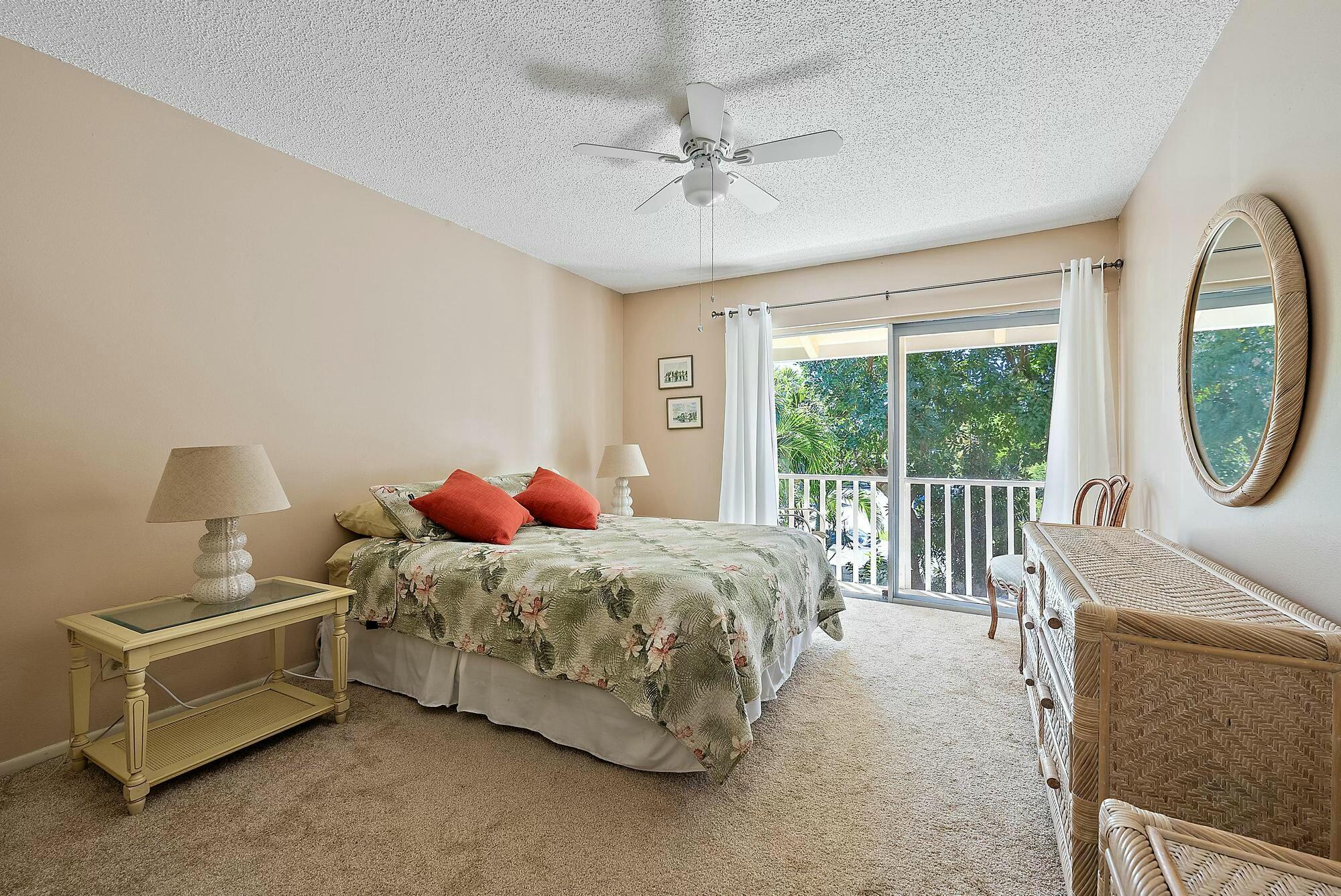 213 Seabreeze Circle Jupiter, FL 33477 - Photo 16 of 38 a bed room with a bed and a window