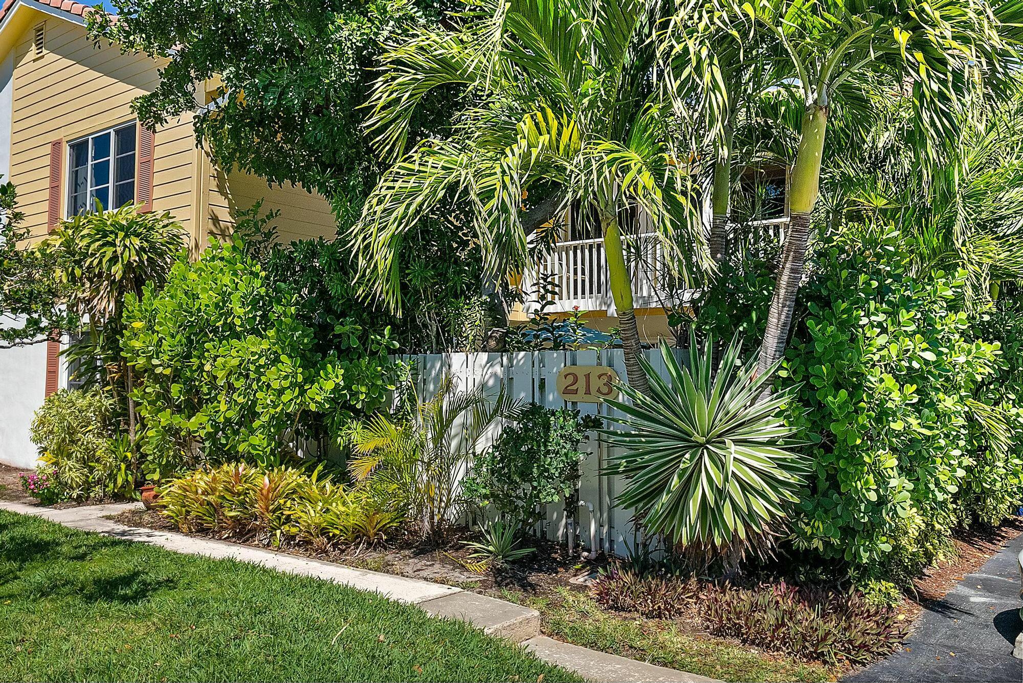 213 Seabreeze Circle Jupiter, FL 33477 - Photo 2 of 38 a view of a yard in front of house