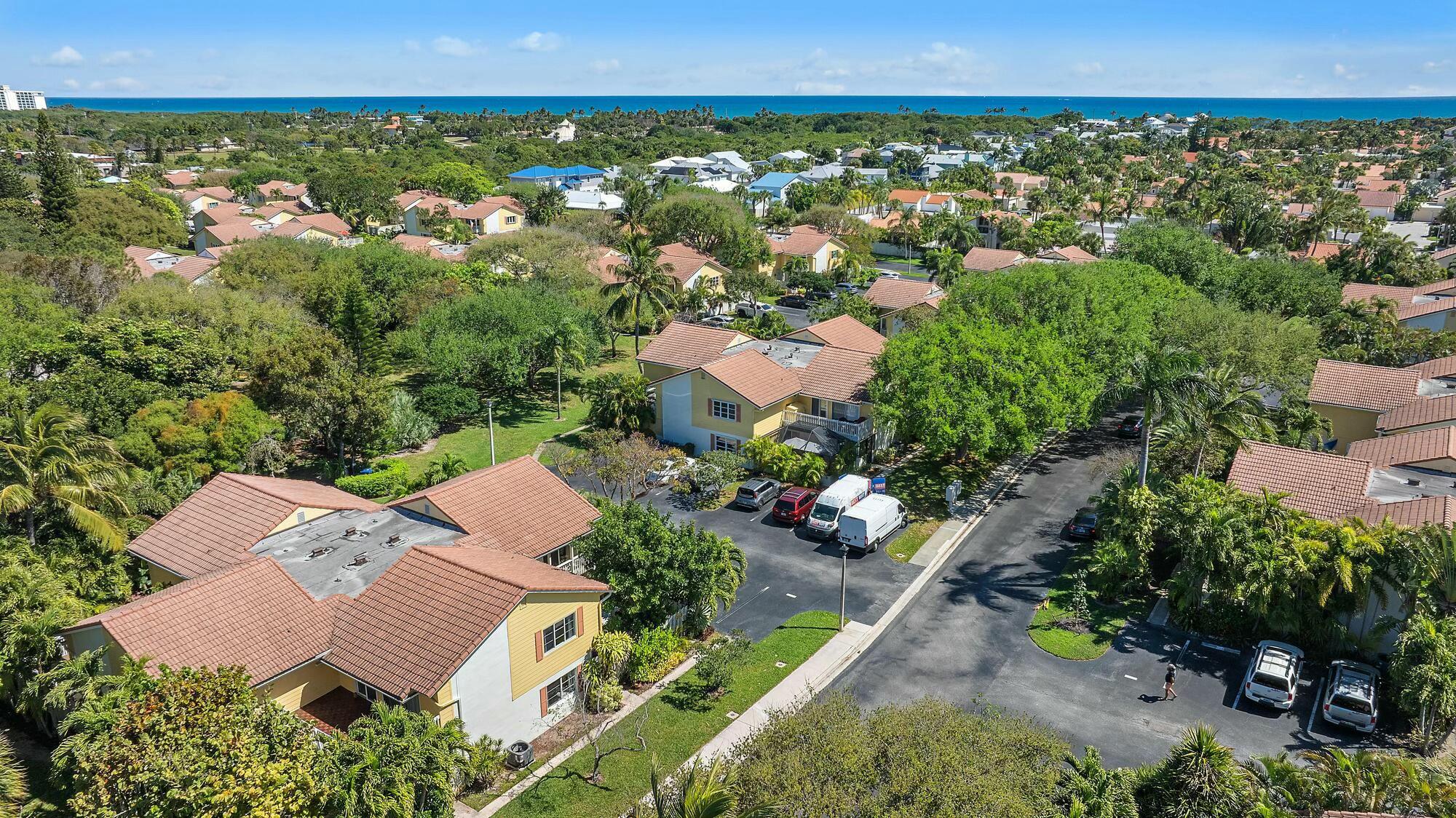 213 Seabreeze Circle Jupiter, FL 33477 - Photo 25 of 38 an aerial view of a house with a yard