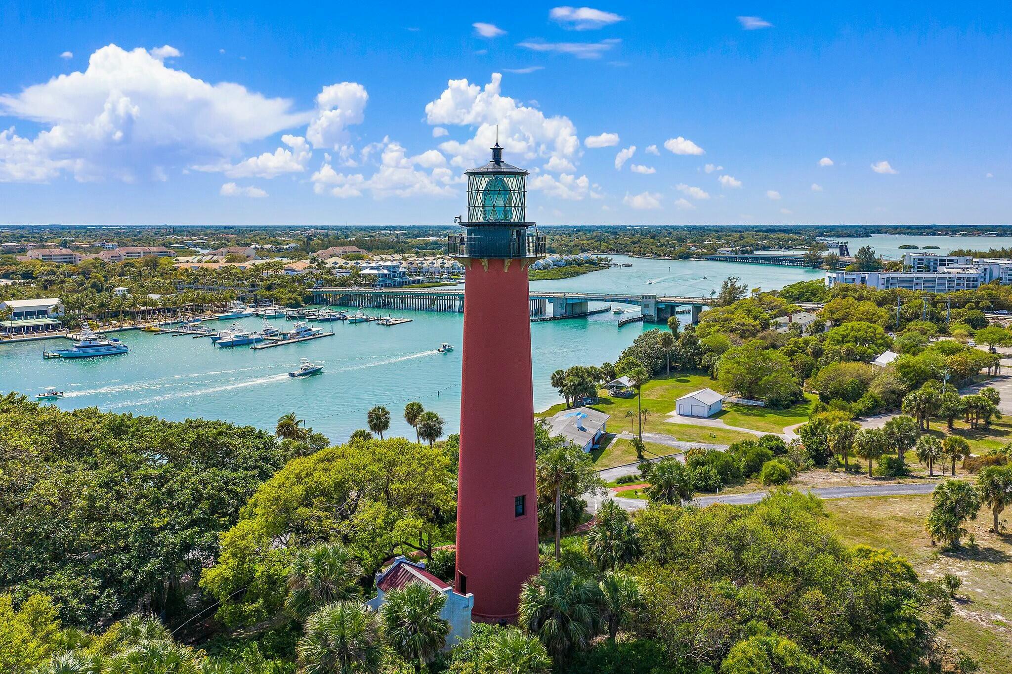 213 Seabreeze Circle Jupiter, FL 33477 - Photo 31 of 38 a view of a lake with a building in the background