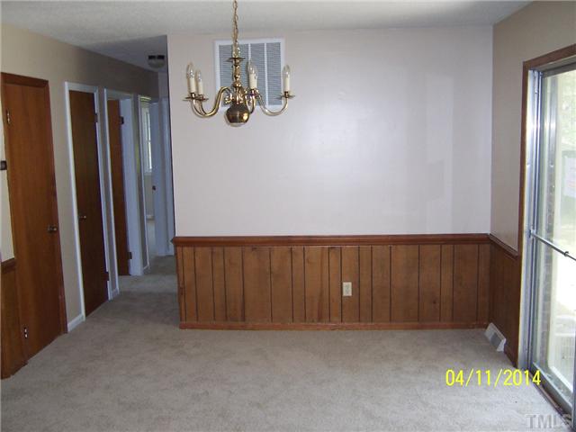 2905 Rannock Court Raleigh, NC 27604 - Photo 5 of 8 an empty room with wooden floor and windows