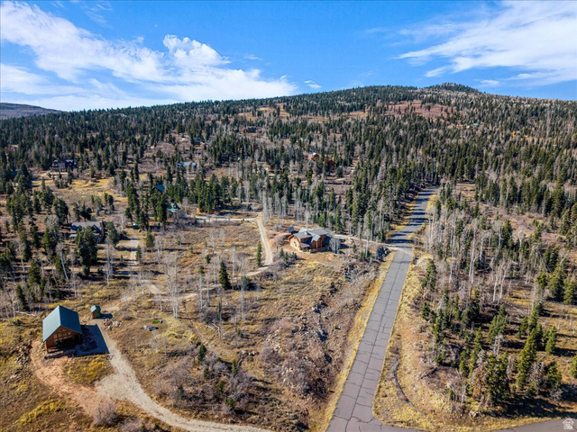 367 Spring Drive, Unit 67 Springdale, UT 84767 - Photo 8 of 13 Aerial view of property and surrounding area with a forest