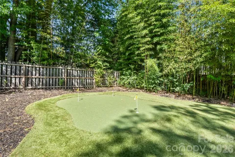 a swimming pool with wooden fence