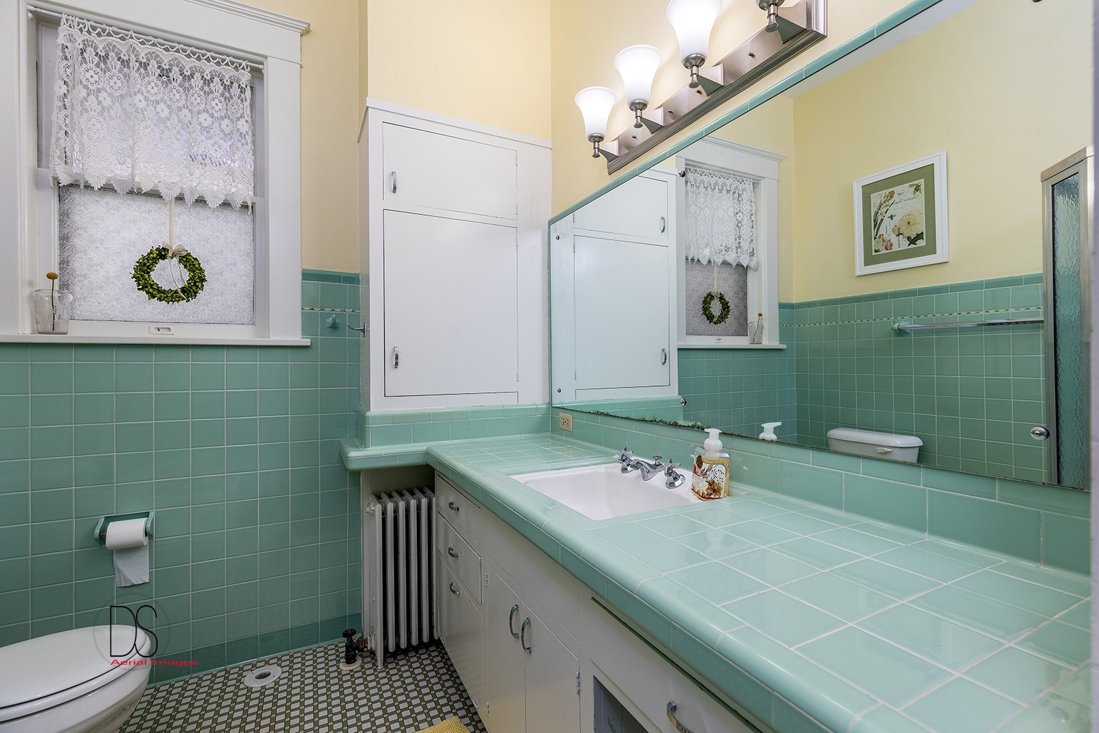 1325 South Main Street Princeton, IL 61356 - Photo 14 of 29 a bathroom with a granite countertop sink a toilet and a mirror