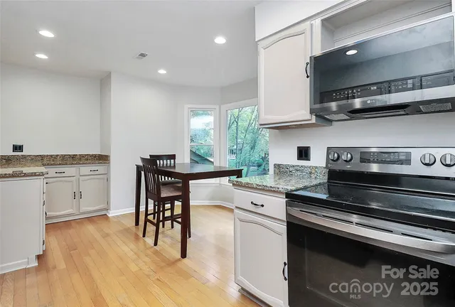 a kitchen with a stove a sink and a refrigerator