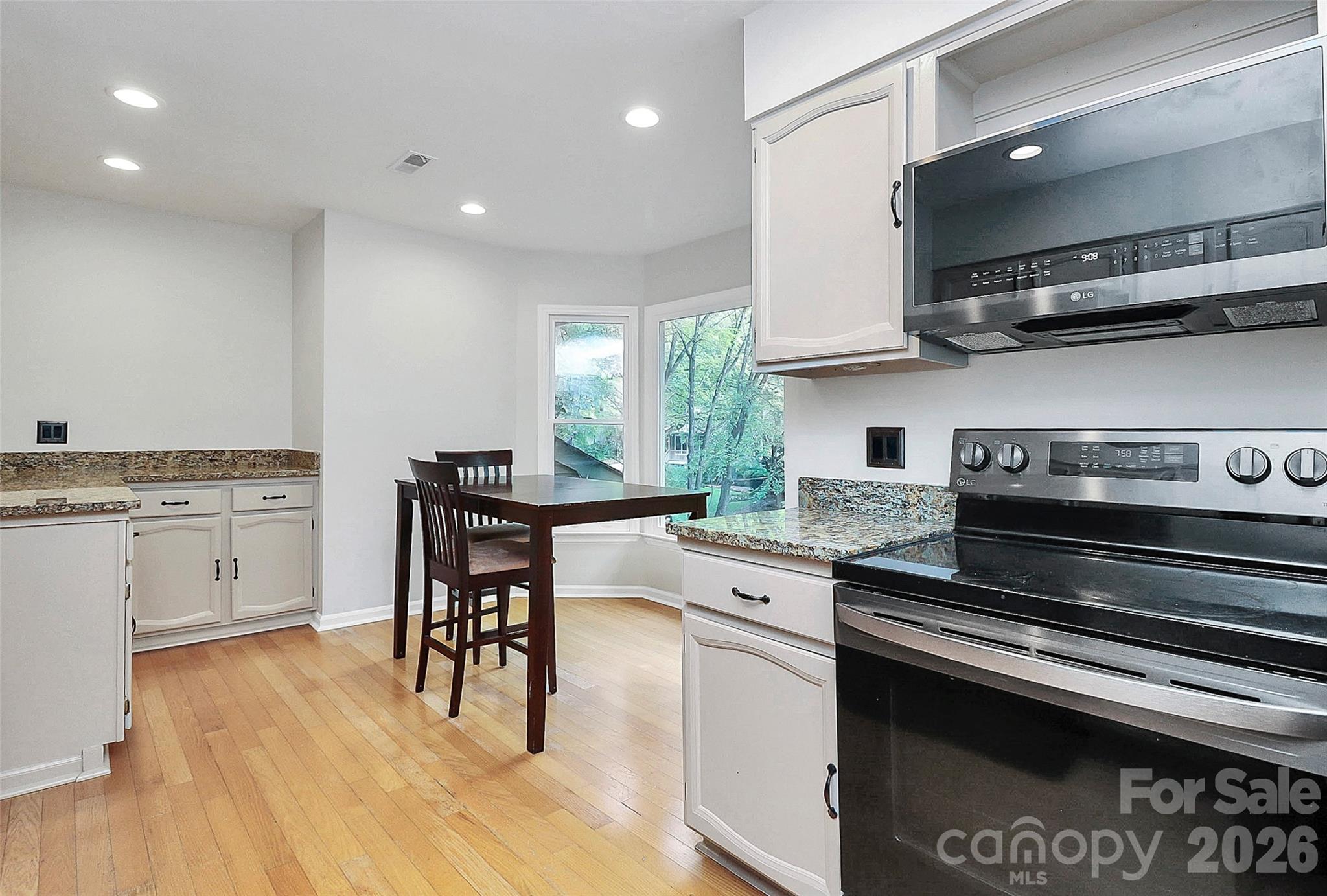 16 Woodvine Lane Clover, SC 29710 - Photo 13 of 48 a kitchen with appliances cabinets and wooden floor