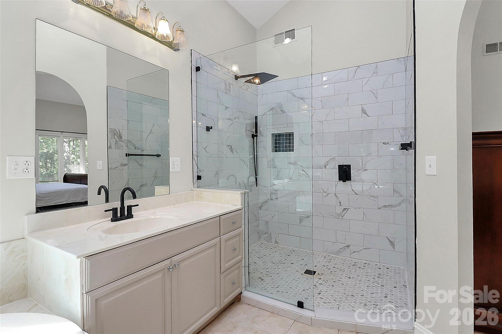 16 Woodvine Lane Clover, SC 29710 - Photo 17 of 48 a bathroom with a shower sink and mirror