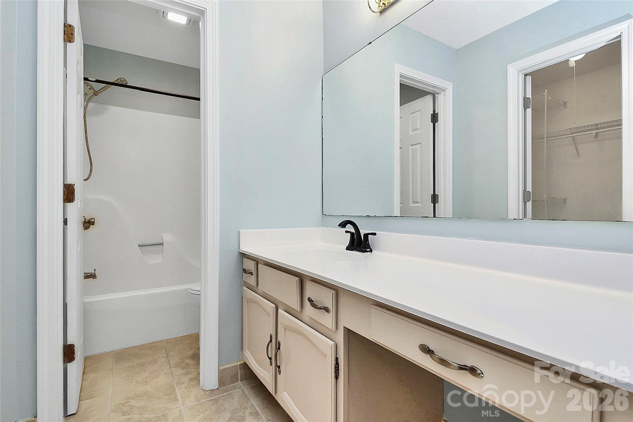 16 Woodvine Lane Clover, SC 29710 - Photo 23 of 48 a bathroom with a granite countertop sink mirror and a bathtub
