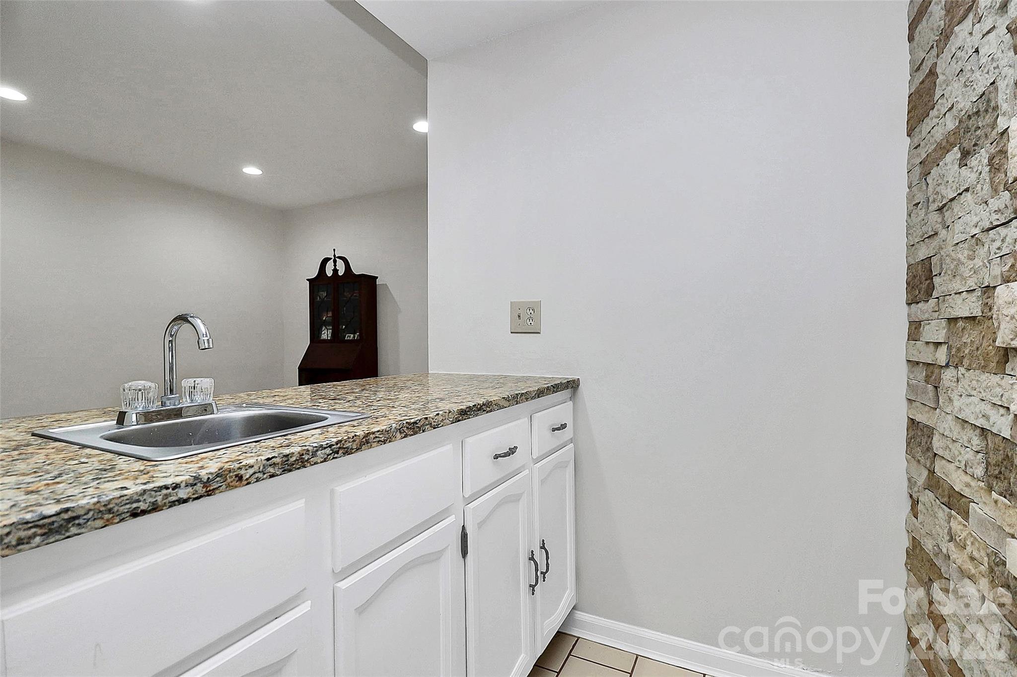 16 Woodvine Lane Clover, SC 29710 - Photo 32 of 48 a bathroom with a granite countertop sink and a mirror