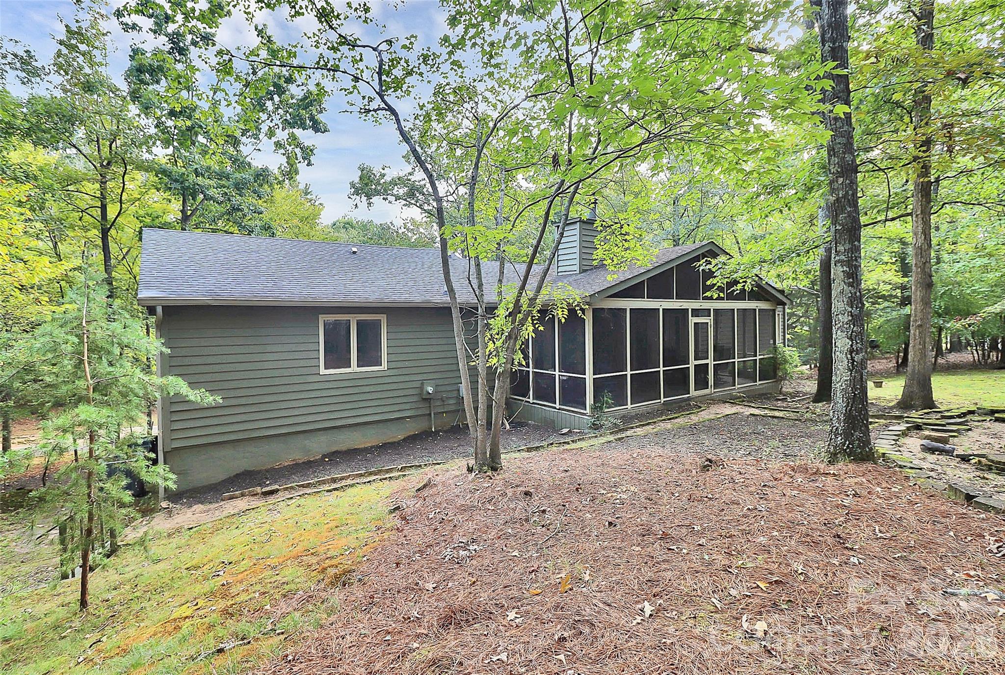 16 Woodvine Lane Clover, SC 29710 - Photo 41 of 48 a view of a house with a yard tree and wooden fence
