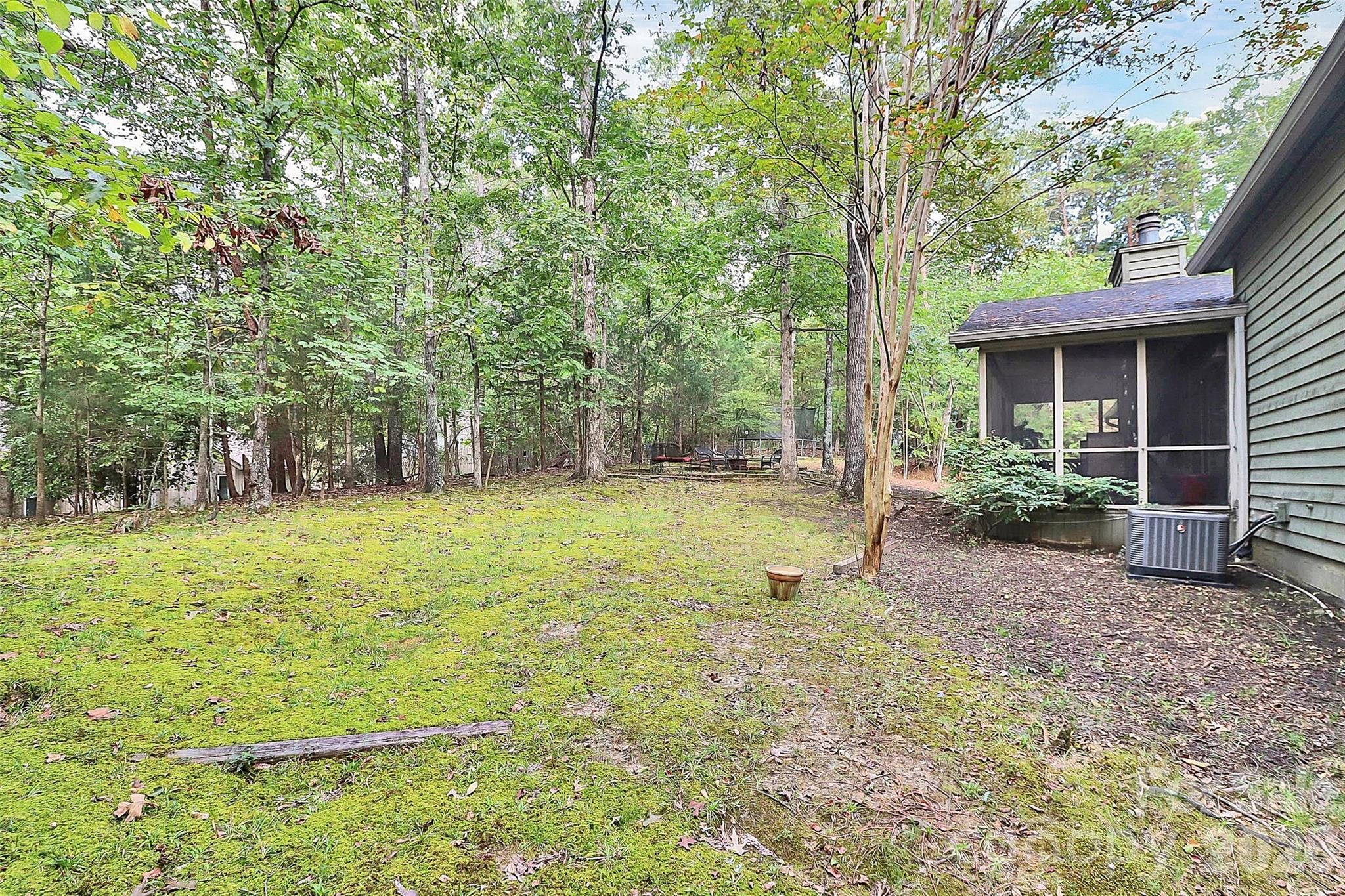 16 Woodvine Lane Clover, SC 29710 - Photo 44 of 48 a view of a backyard with a garden and trees