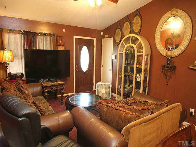 404 Top Greene Lane Raleigh, NC 27601 - Photo 2 of 11 a living room with furniture and a flat screen tv