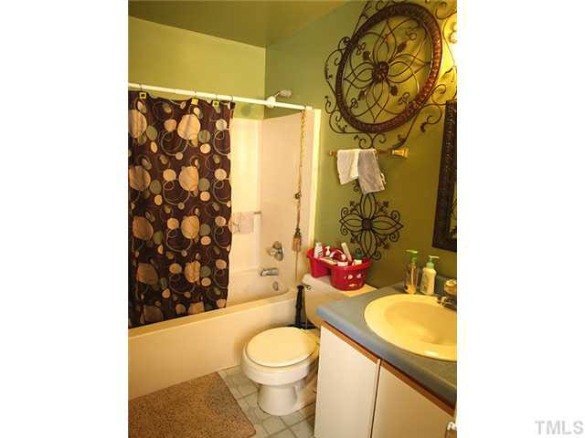 404 Top Greene Lane Raleigh, NC 27601 - Photo 9 of 11 a bathroom with a sink toilet and shower
