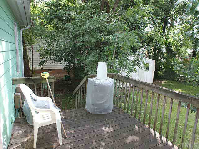 404 Top Greene Lane Raleigh, NC 27601 - Photo 10 of 11 a view of a chair and table in the balcony