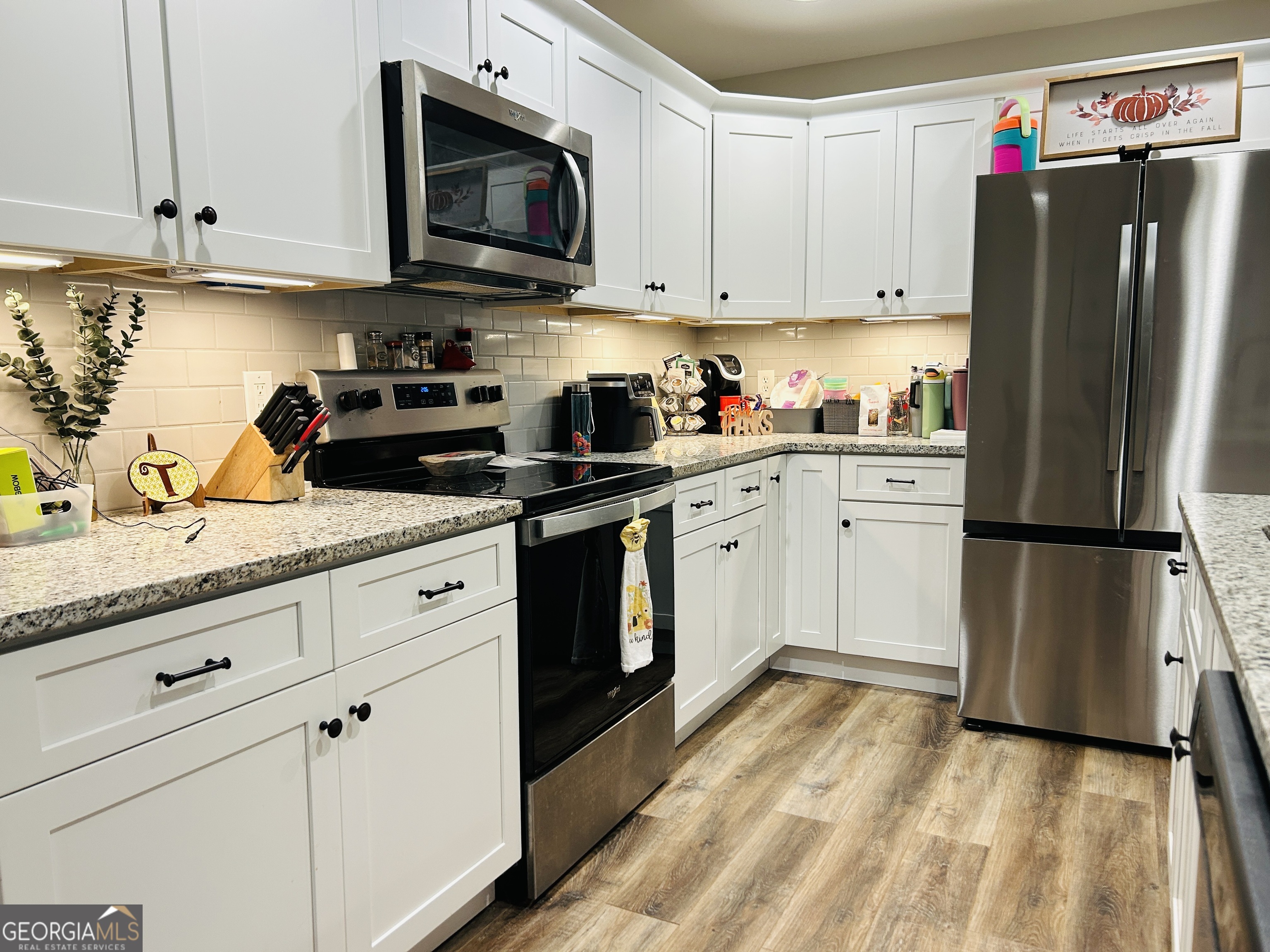 3077 Alec Mountain Road Clarkesville, GA 30523 - Photo 13 of 35 a kitchen with stainless steel appliances granite countertop a refrigerator sink and stove