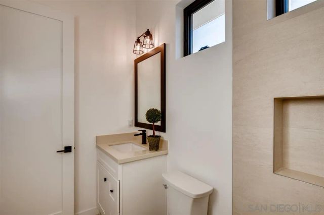 a bathroom with a toilet and a sink