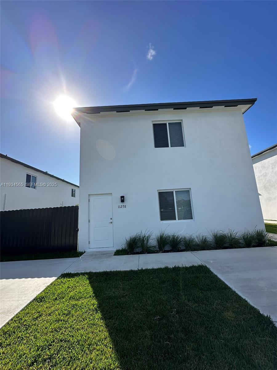 a house with garden in front of it