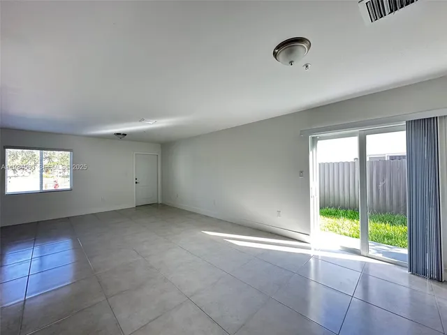 a view of an empty room and window