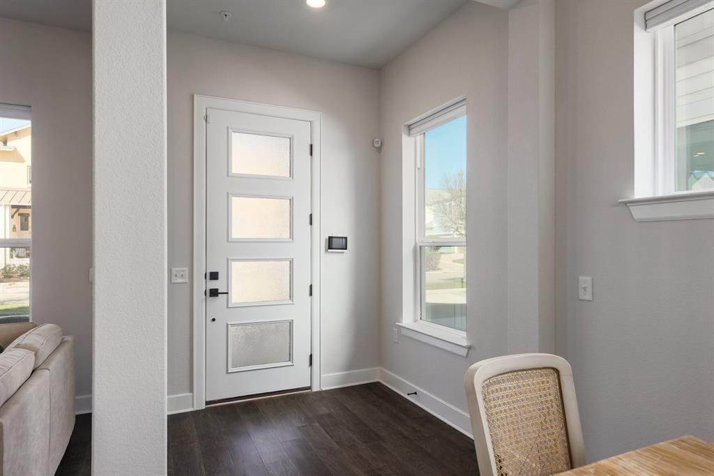 3907 Tilley Street Austin, TX 78723 - Photo 10 of 26 a view of a livingroom with wooden floor and windows