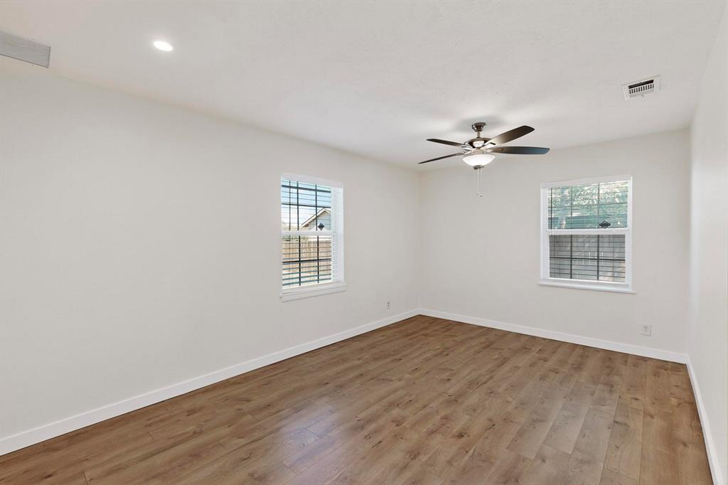 2519 Maverick Avenue Dallas, TX 75228 - Photo 13 of 31 wooden floor in an empty room with a window