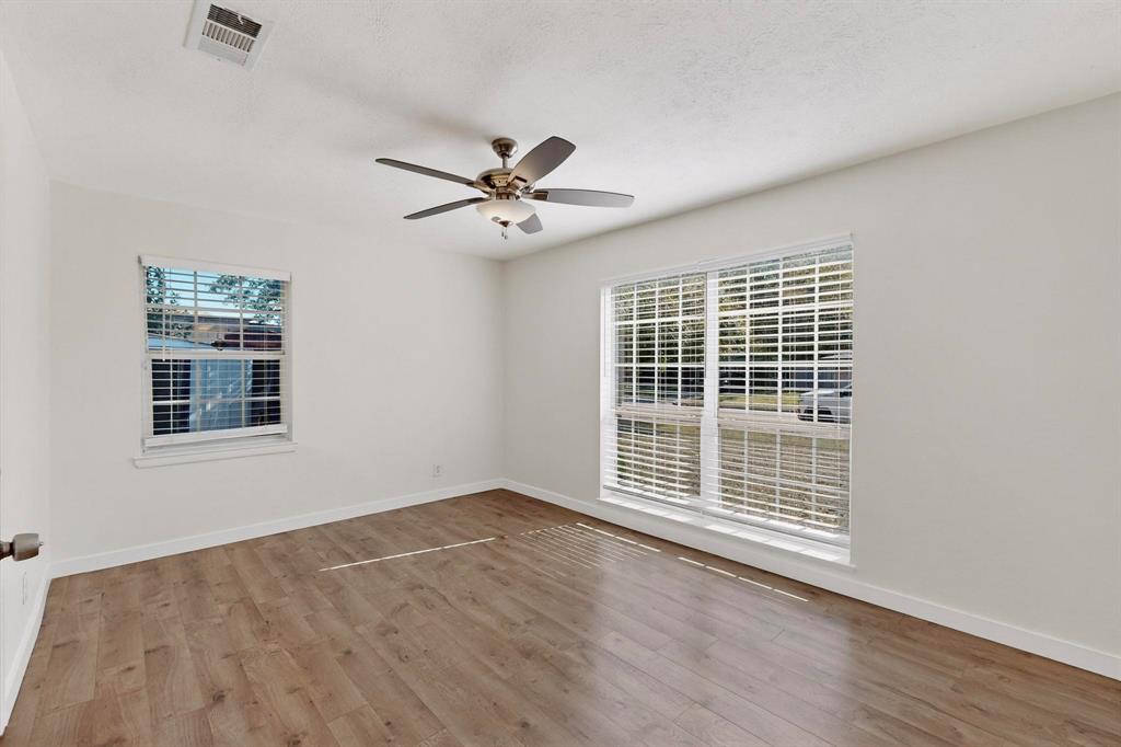 2519 Maverick Avenue Dallas, TX 75228 - Photo 19 of 31 an empty room with wooden floor and windows