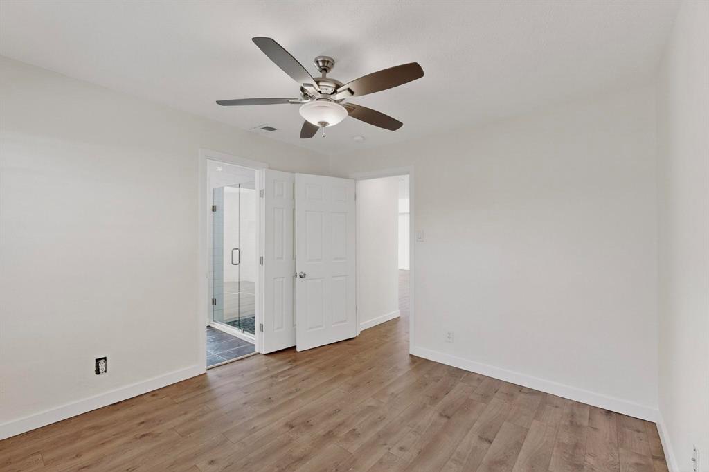 2519 Maverick Avenue Dallas, TX 75228 - Photo 22 of 31 a view of an empty room with wooden floor