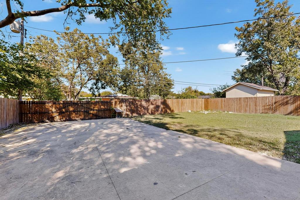 2519 Maverick Avenue Dallas, TX 75228 - Photo 25 of 31 a view of a house with a yard and large trees