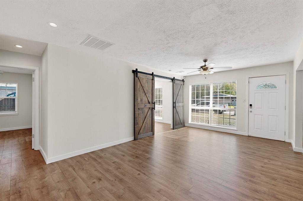 2519 Maverick Avenue Dallas, TX 75228 - Photo 30 of 31 wooden floor in an empty room with a window