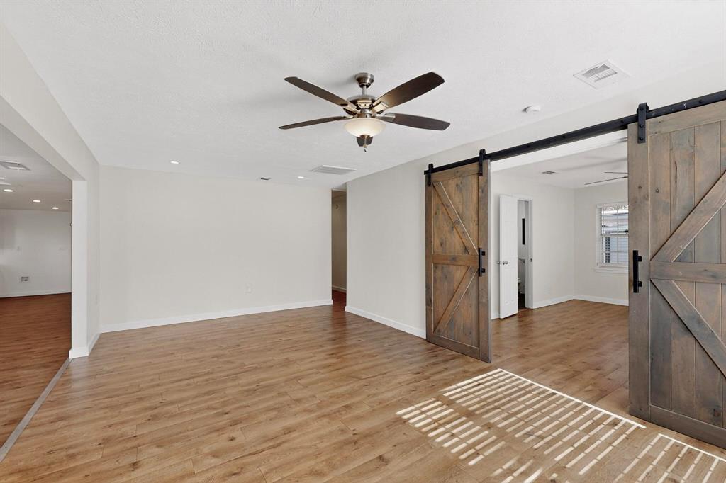 2519 Maverick Avenue Dallas, TX 75228 - Photo 31 of 31 a view of an empty room with wooden floor and a ceiling fan