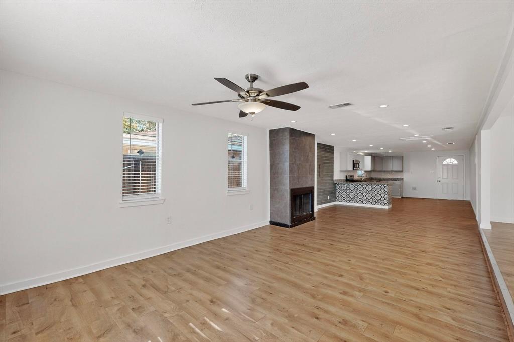 2519 Maverick Avenue Dallas, TX 75228 - Photo 4 of 31 a view of an empty room with kitchen and a window