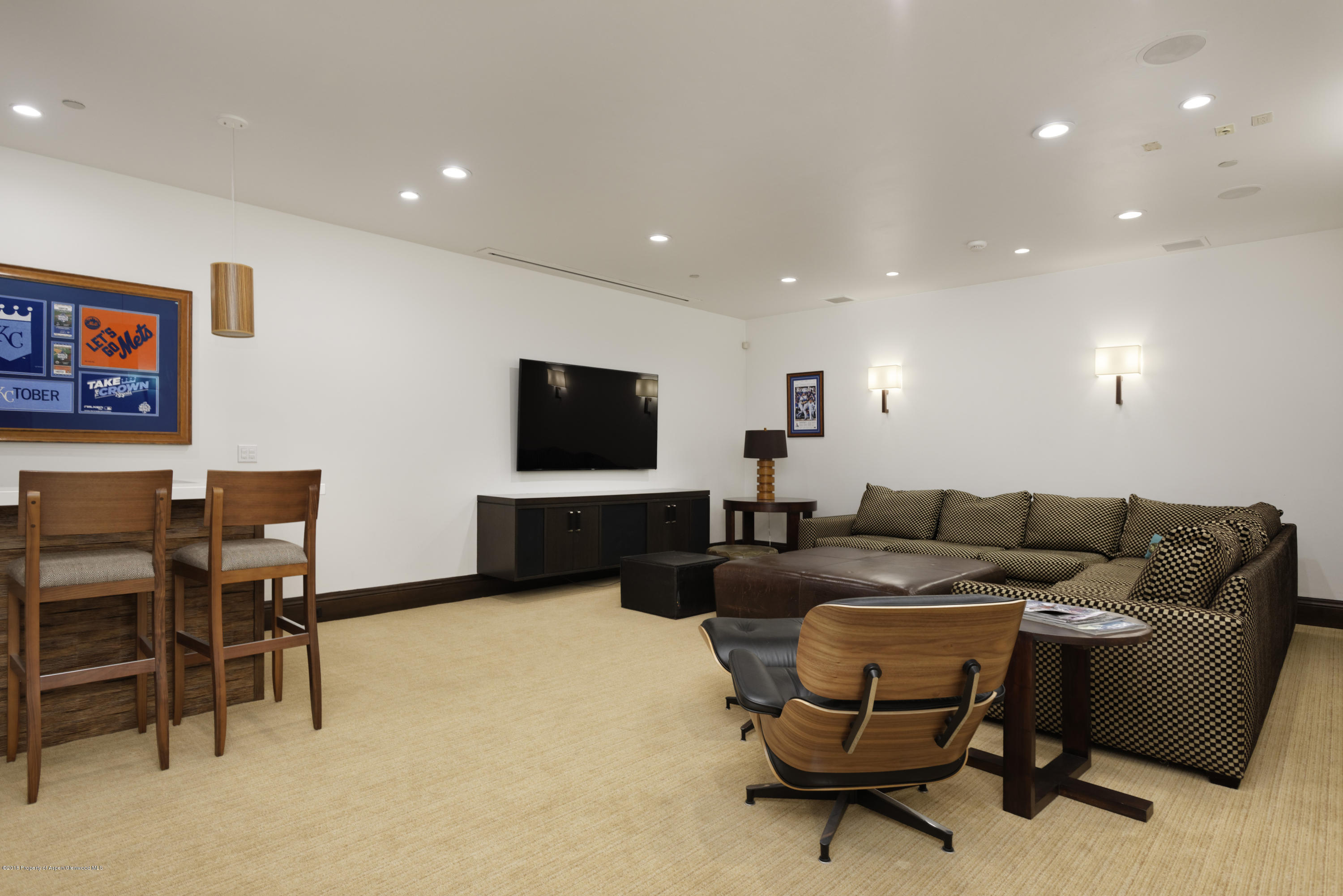 566 Race Street Aspen, CO 81611 - Photo 12 of 21 a living room with furniture and a flat screen tv