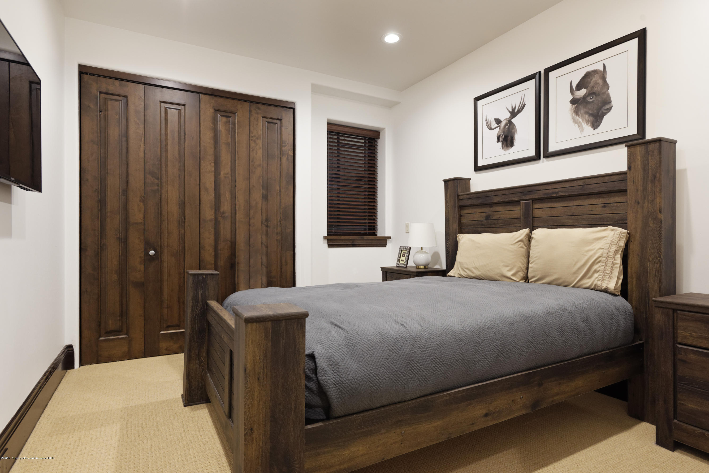 566 Race Street Aspen, CO 81611 - Photo 15 of 21 a bedroom with a bed and night stand