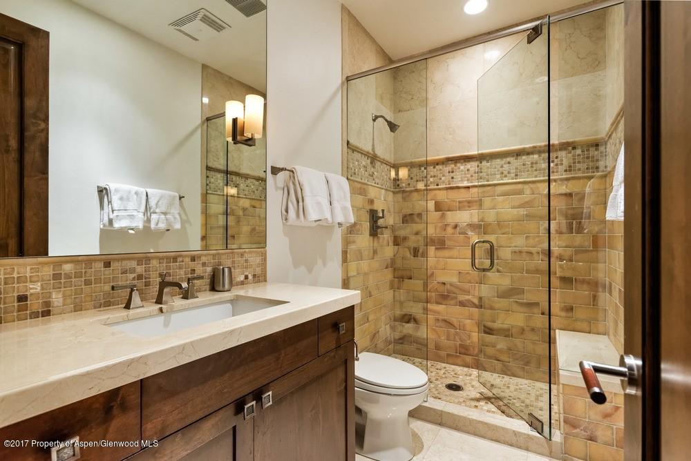 566 Race Street Aspen, CO 81611 - Photo 16 of 21 a bathroom with a sink vanity mirror and toilet