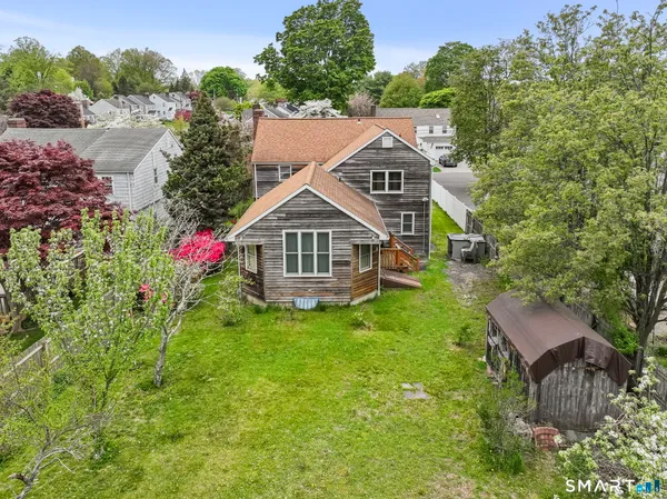 a aerial view of a house with a yard