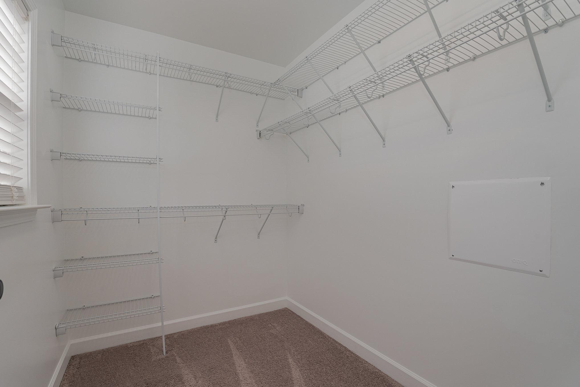 407 East 3rd Street Princeton, NC 27569 - Photo 11 of 18 a view of a room with racks on the wall