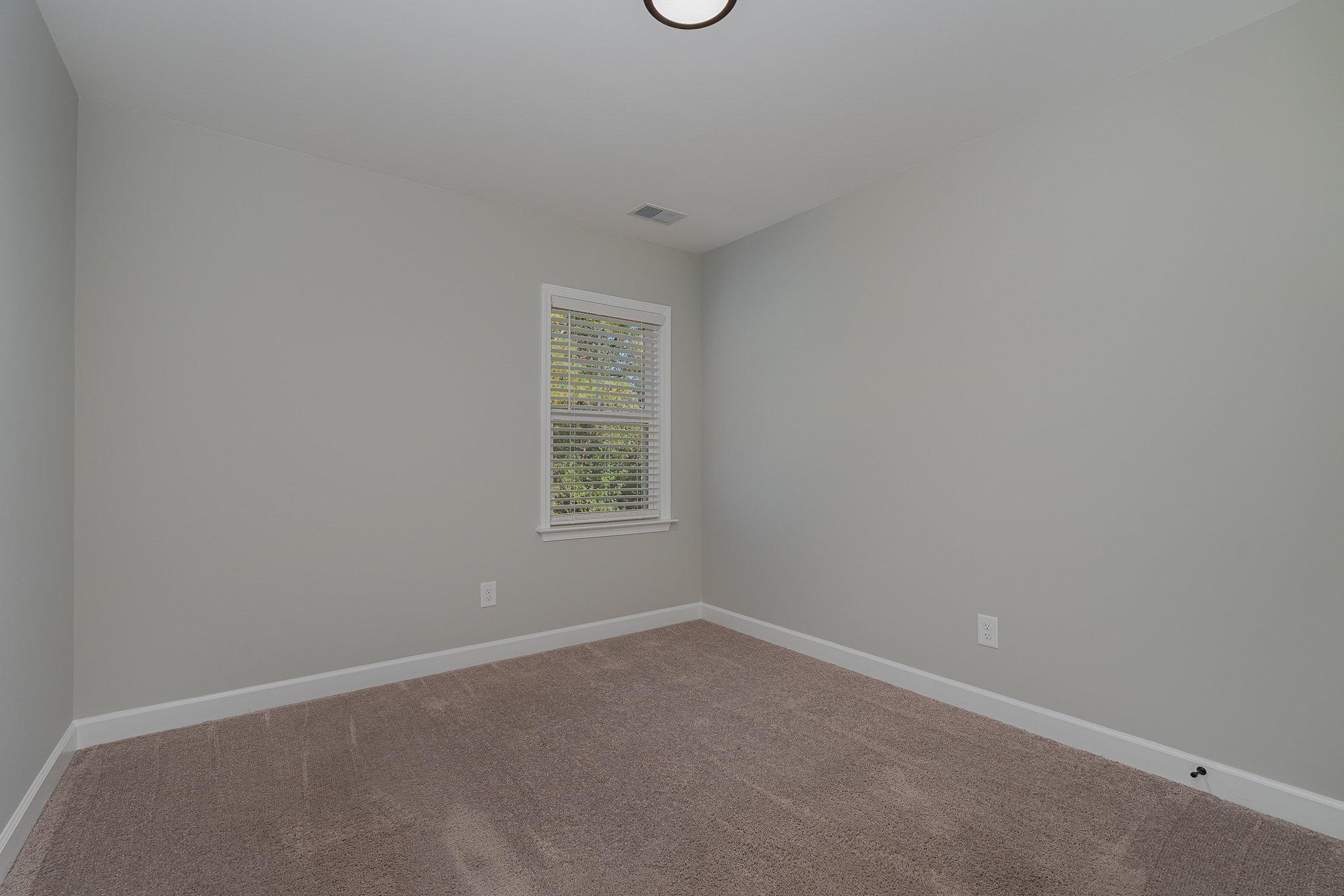 407 East 3rd Street Princeton, NC 27569 - Photo 12 of 18 an empty room with a window