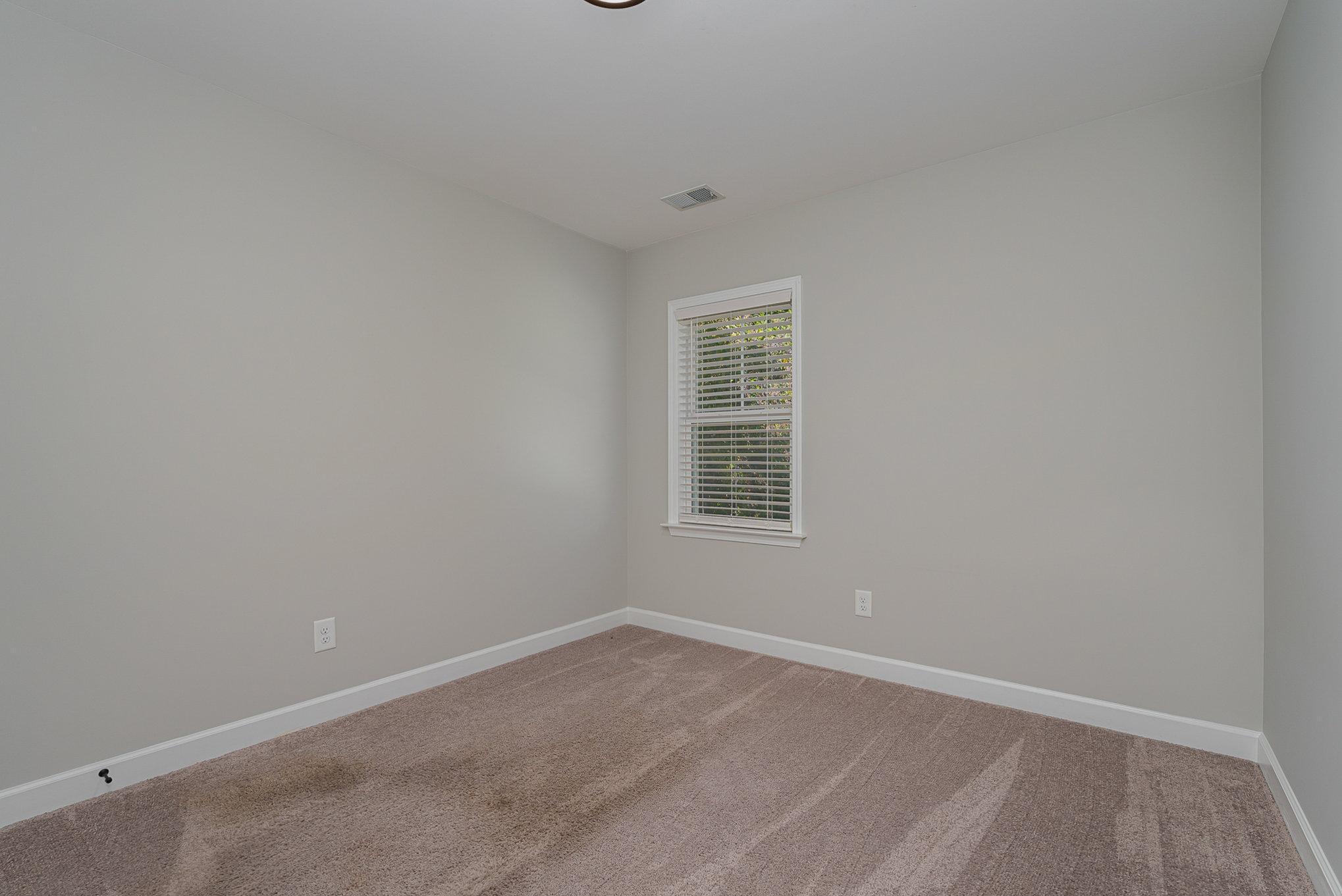 407 East 3rd Street Princeton, NC 27569 - Photo 13 of 18 an empty room with a window